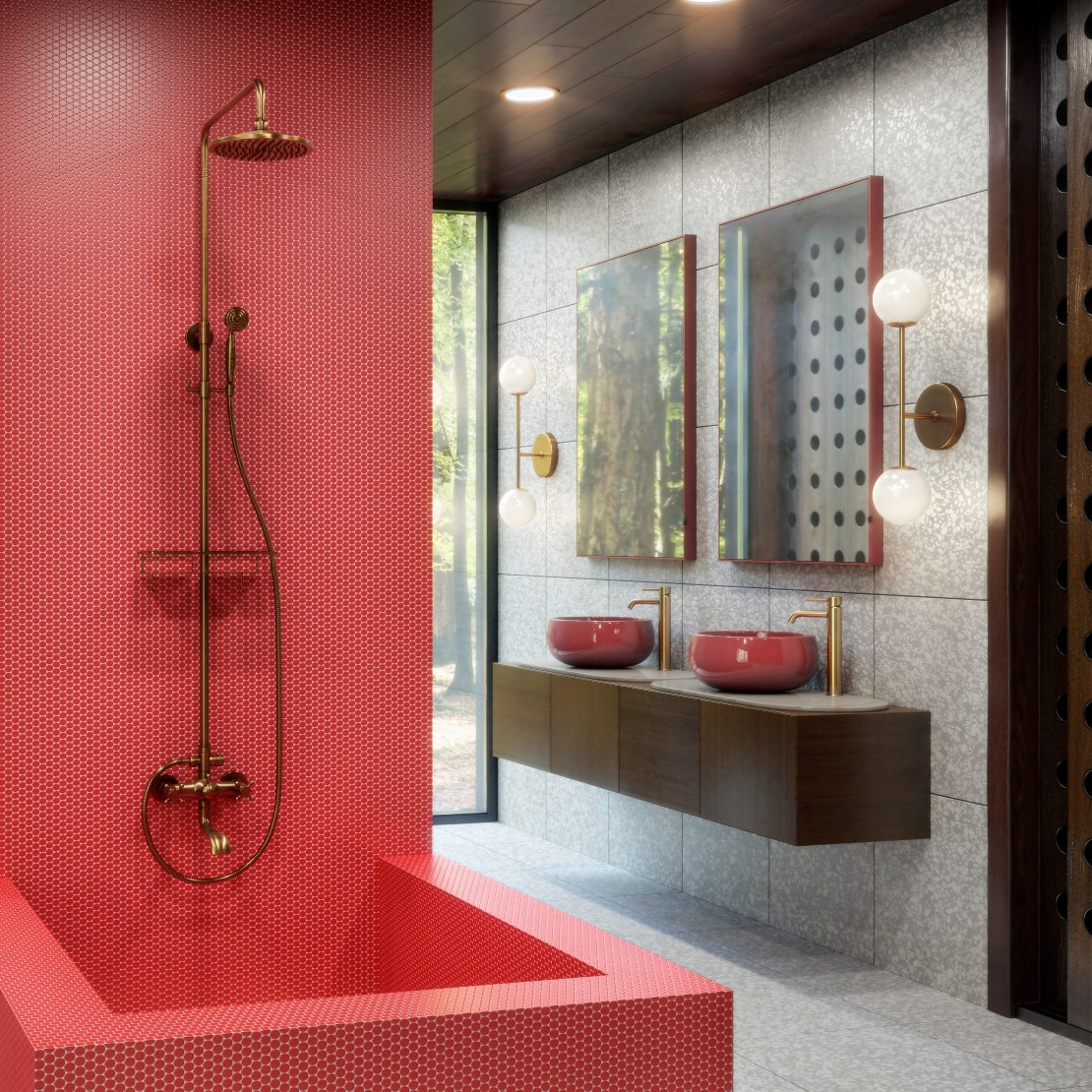 Red tiled bathtub with gold shower head and red sinks. 