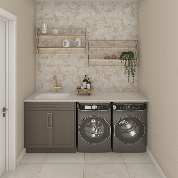 Laundry room with built-in sink, off-white quartz countertop, white & beige hexagon marble wall tile, front-loading washer and dryer, off-white floor tile.