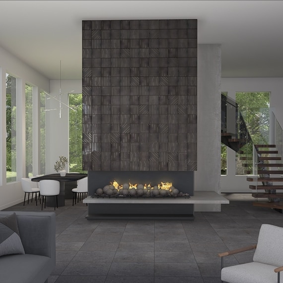 Open concept living and dining room with gas fireplace with gray metallic tile facade, dark gray tile flooring, floor-to-ceiling windows, and floating staircase.