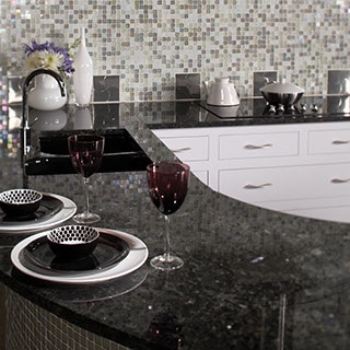 Granite with large flecks of dark and light blue, white, grey and black.