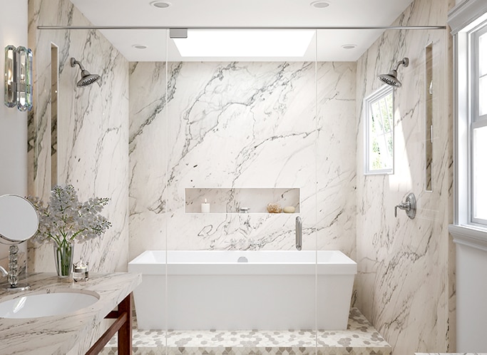 Bathroom with white quartzite shower walls and countertops, and white mosaic on shower floor.