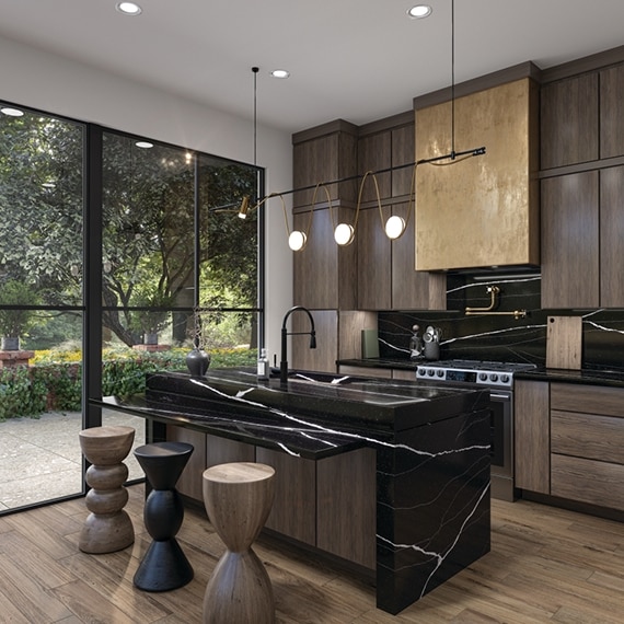 Kitchen with white veined black quartz countertop, waterfall island, and backsplash, wood cabinets, and wood-look tile flooring.