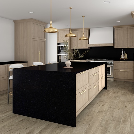 Kitchen with black quartz countertop, waterfall island, and backsplash, natural wood cabinets, and wood look tile flooring.