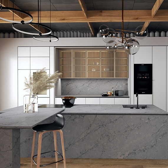 Kitchen with gray quartzite on center island, countertops, and backsplash.