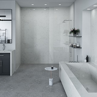Modern bathroom design with white with gray veining quartz slab vanity countertop, shower walls, bathtub, and backsplash, and gray concrete look floor tile.