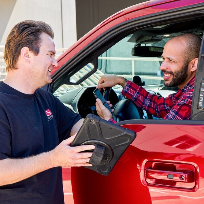 A Daltile Sales Service Center manager reviewing a customers order.