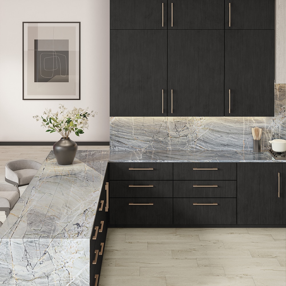 Kitchen with gray quartzite countertop and backsplash, black cabinets, and light wood floor.