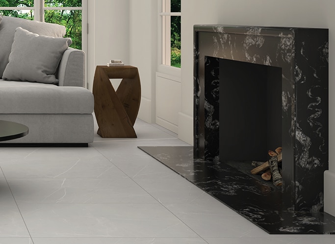 Living room fireplace with a black granite slab surrounding fireplace.