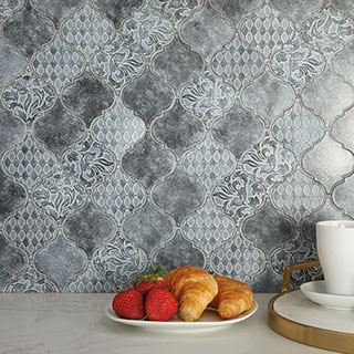 Antique metallic arabesque mosaic backsplash. Tiles have different raised patterns on each tile.