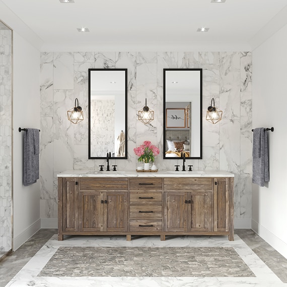 Bathroom with wood vanity, marble countertop, dual mirrors on white & gray marble look tile backsplash, gray stone look floor tile with white stone look tile inset.
