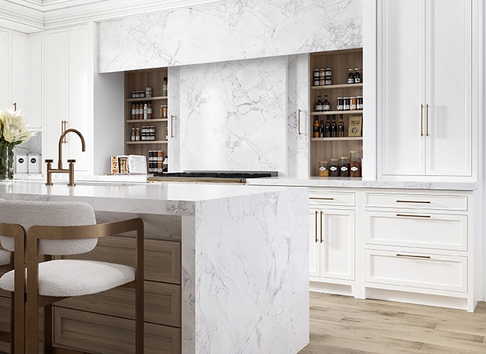 Kitchen with center island, white cabinets, white sitting chairs, and white marble countertops and backsplash