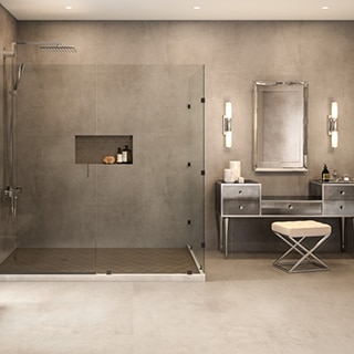 Open concept bathroom with floor-to-ceiling, concrete look, extra-large format porcelain shower with glass enclosure.