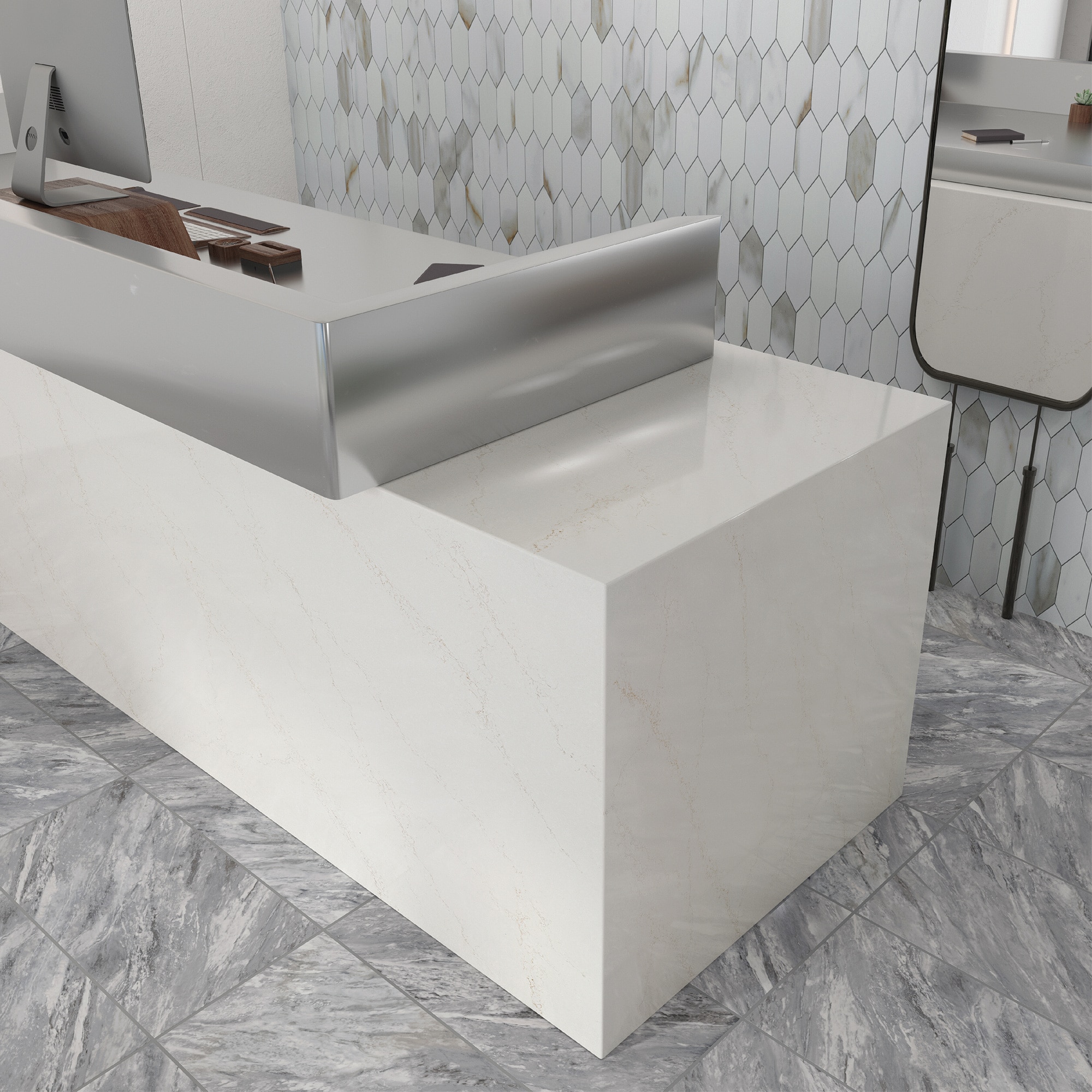 Desk with gray marble look tile, white mosaic on the walls, a mirror on the wall, a computer, and a white marble slab desk.