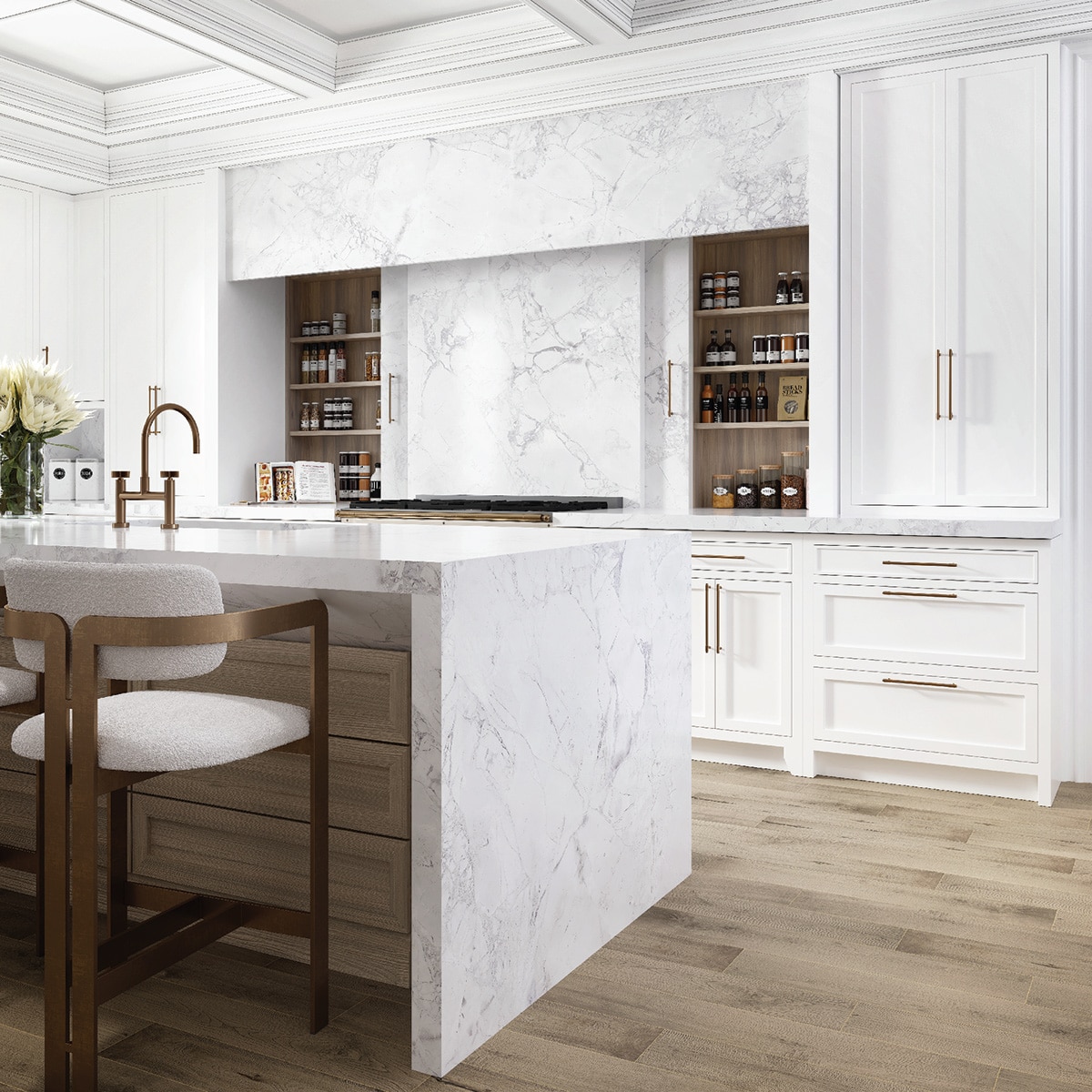 Kitchen with white marble slab countertop and backsplash, island with waterfall white marble slab countertop, and light wood floors.