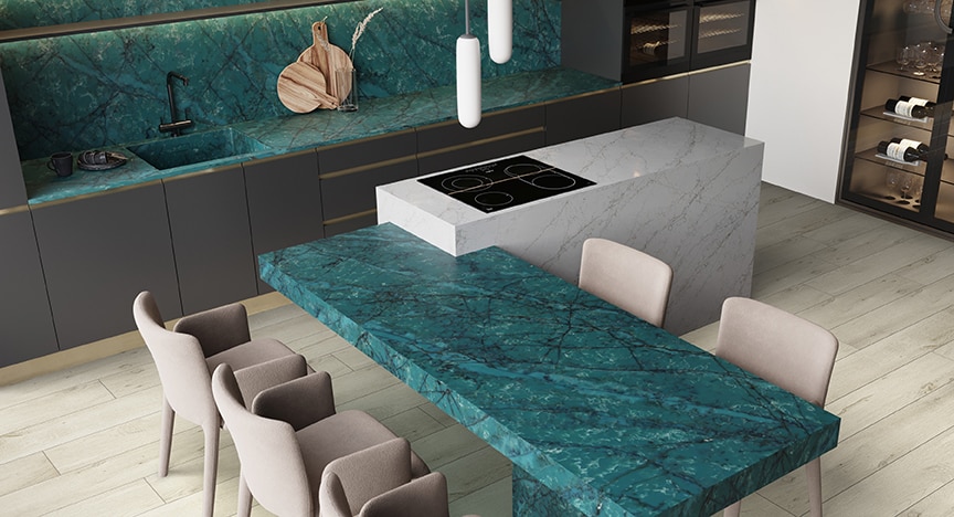 Kitchen with blue quartz countertops, light wood floors, and beige sitting chairs.
