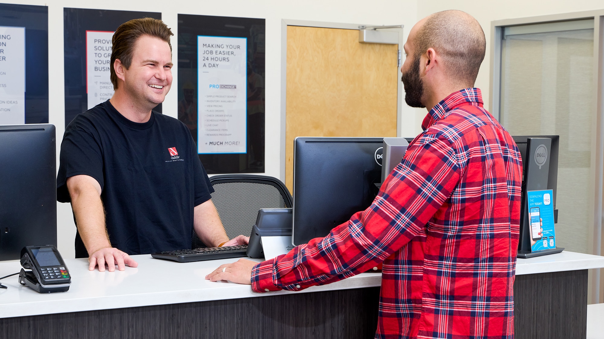 A Daltile Sales Service Center managing assisting a customer with their order.