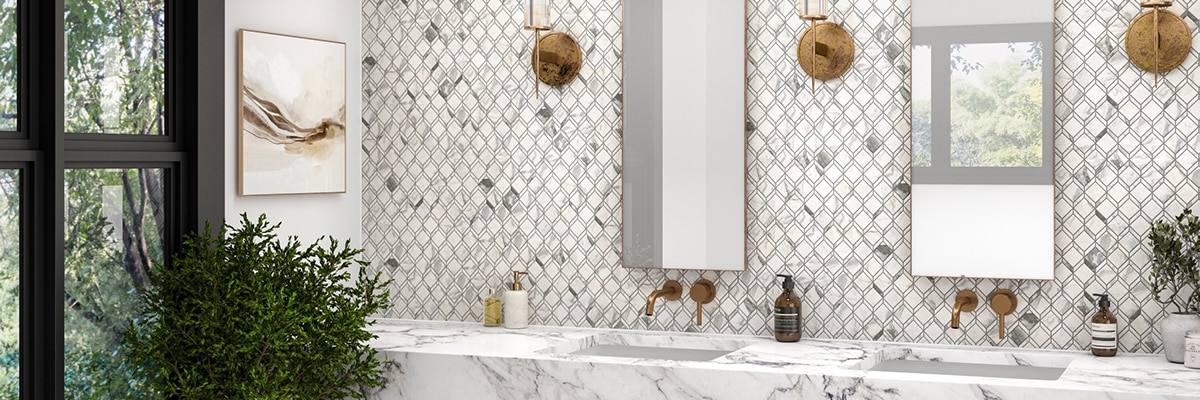 Bathroom with white and gray marble mosaic backsplash, floating vanity with white & gray marble-look counter and shelf, and copper fixtures.