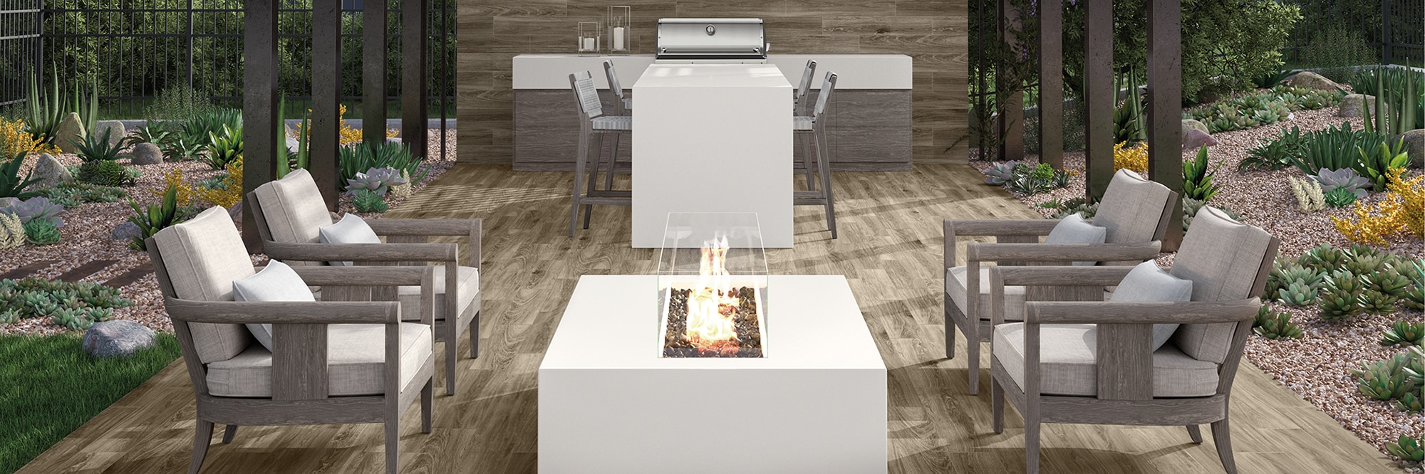 Outdoor patio / kitchen with floor tiles that look like wood, white porcelain slab island and firepit, and stainless steel grill.