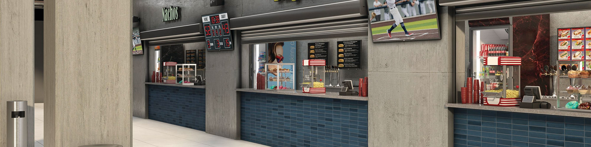 Baseball stadium concession stands with gray quartz countertops, blue subway wall tile, beige floor tile that looks like concrete.