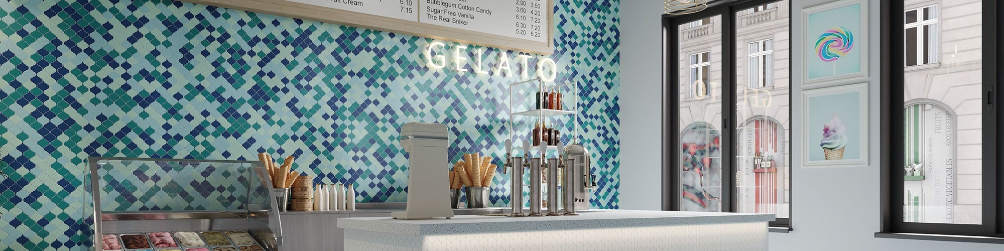 Ice cream parlor with light blue, navy, and teal arabesque mosaic wall tile with menu and ‘Gelato’ neon sign, and white quartz checkout counter.