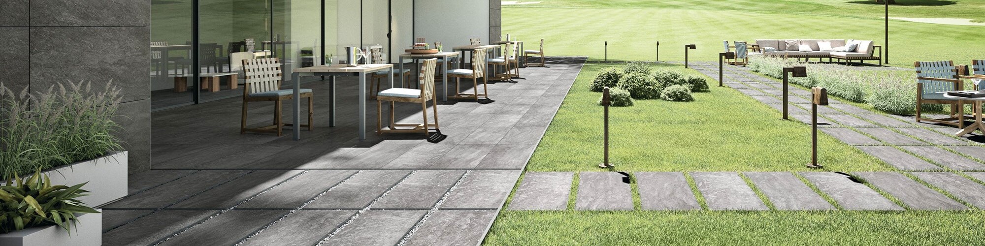 Golf club with stone-look gray porcelain cladding, outdoor dining room with gray stone-look tile flooring with matching 2CM paver pathway set in grass.