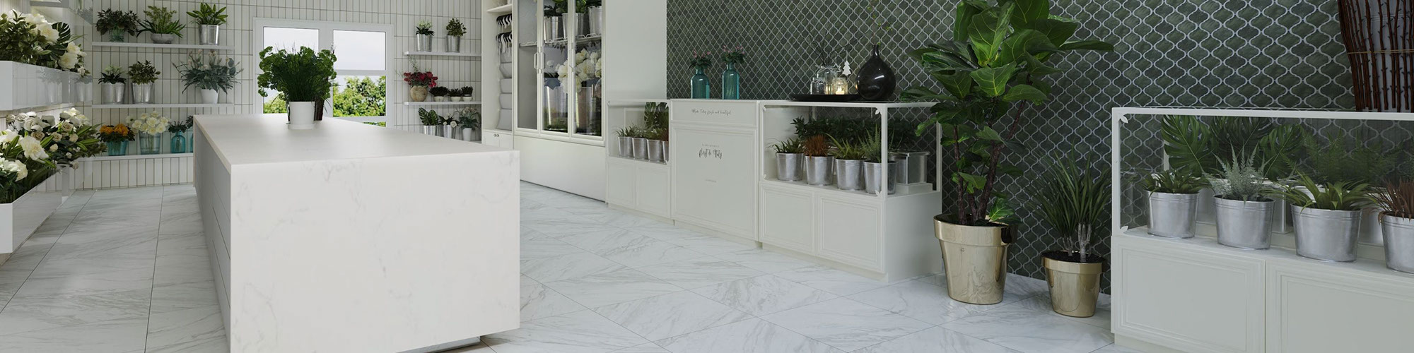 Flower shop with white floor tiles that look like marble, green arabesque mosaic wall tile, white floating shelves holding plants and flower bouquets.