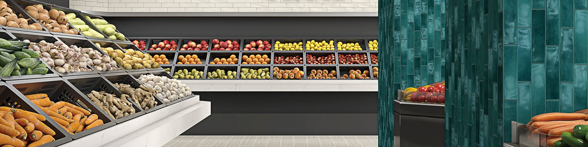 Produce section of a grocery store with floor tiling that looks like light wood planks, bright teal tile pillars, bins full of fruits & vegetables.