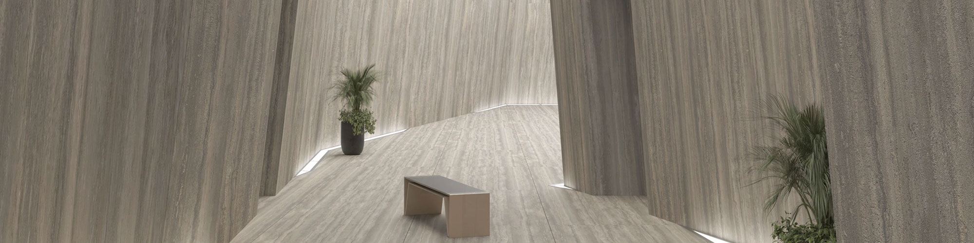 Corridor with benches, potted plants, tan travertine looking porcelain slab walls and floor.