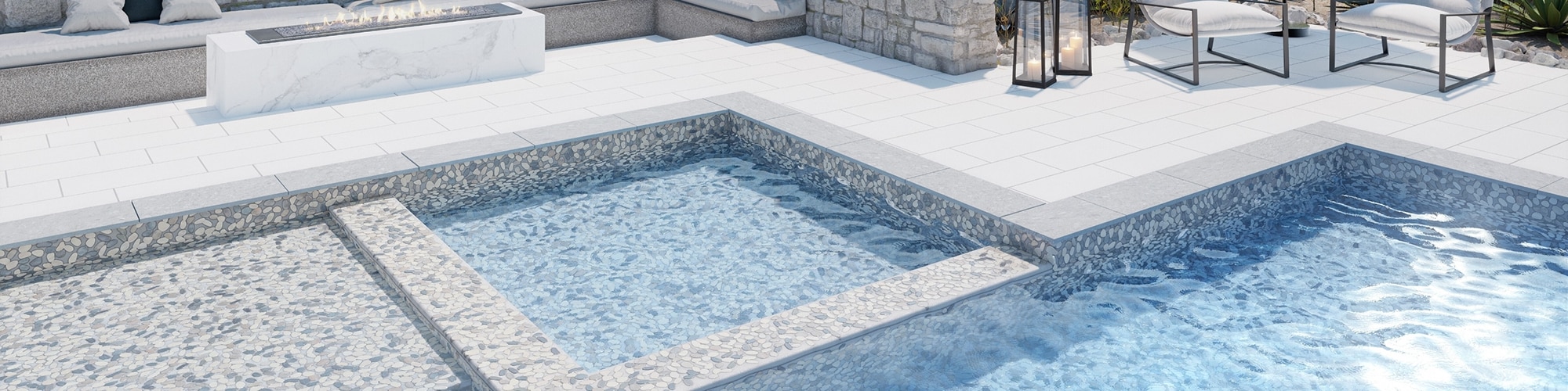 Pool and hot tub with white and gray pebble mosaic pool tile and gray tile border, pool deck with white tile, firepit with marble-look porcelain slab, and outdoor couches.