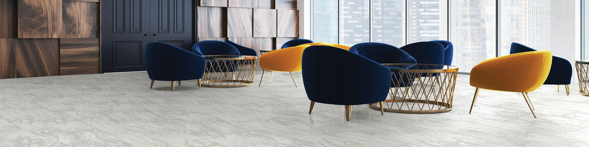 Highrise lounge area with white & gray floor tile that looks like marble, navy and yellow velvet chairs, and windows with view of city skyline.