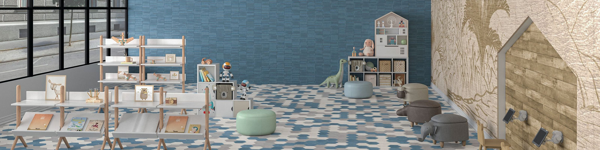 Children’s playroom with blue, white, and gray hexagon floor tile, blue wall tile, mural, bookshelves, dollhouse, and child-size ottomans.