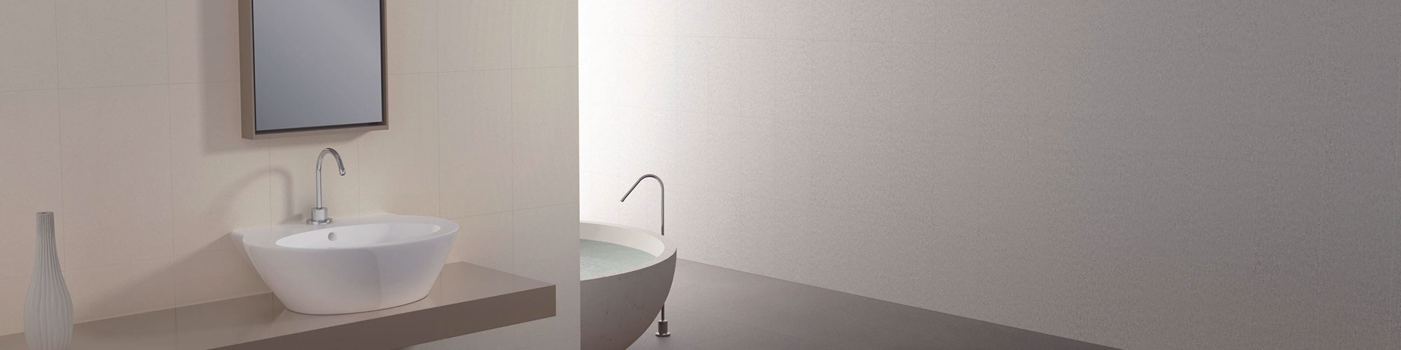 Ultra-modern bathroom with brown floor tile, tan floating vanity hold a white vessel sink, beige wall tile, and soaker bathtub. 