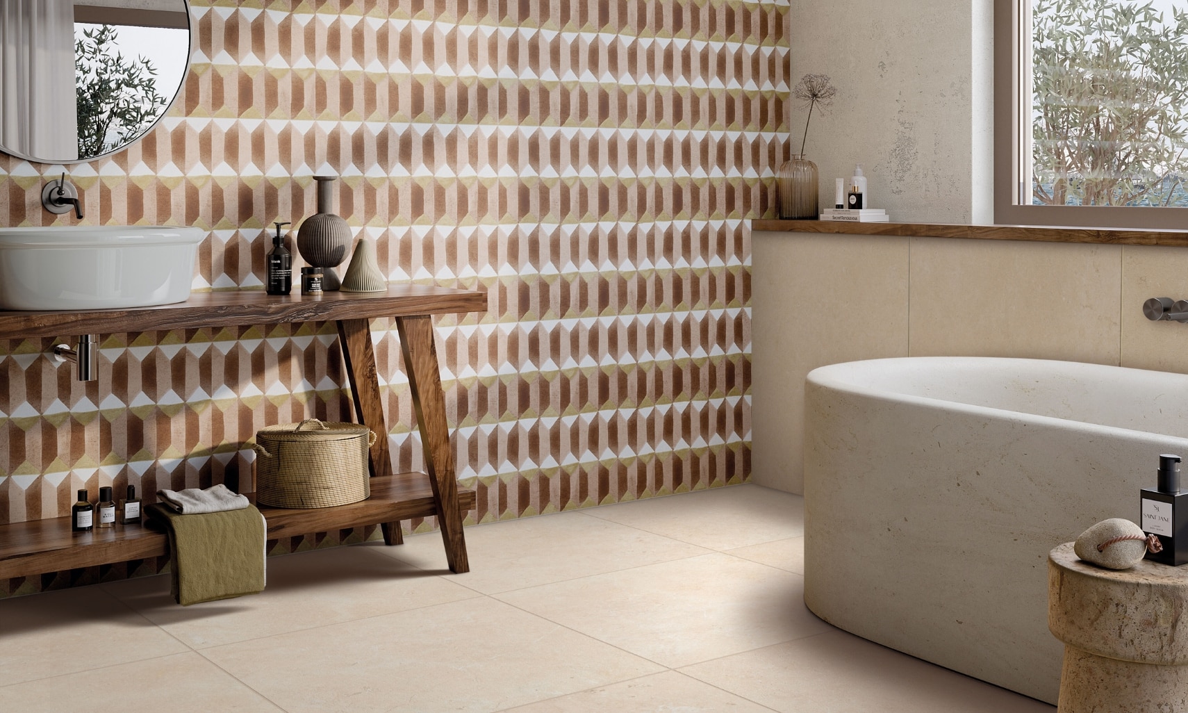 Bathroom with terracotta, peach, and white decorative wall tile, beige limestone stone look floor tile, soaker tub, vessel sink on wood vanity.