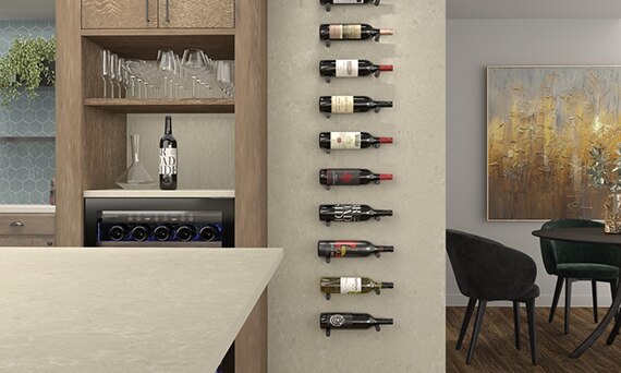 Kitchen with greige quartz island countertop & backsplash that looks like stone, wall-mounted wine rack, natural wood cabinets, and wood like floor tile.