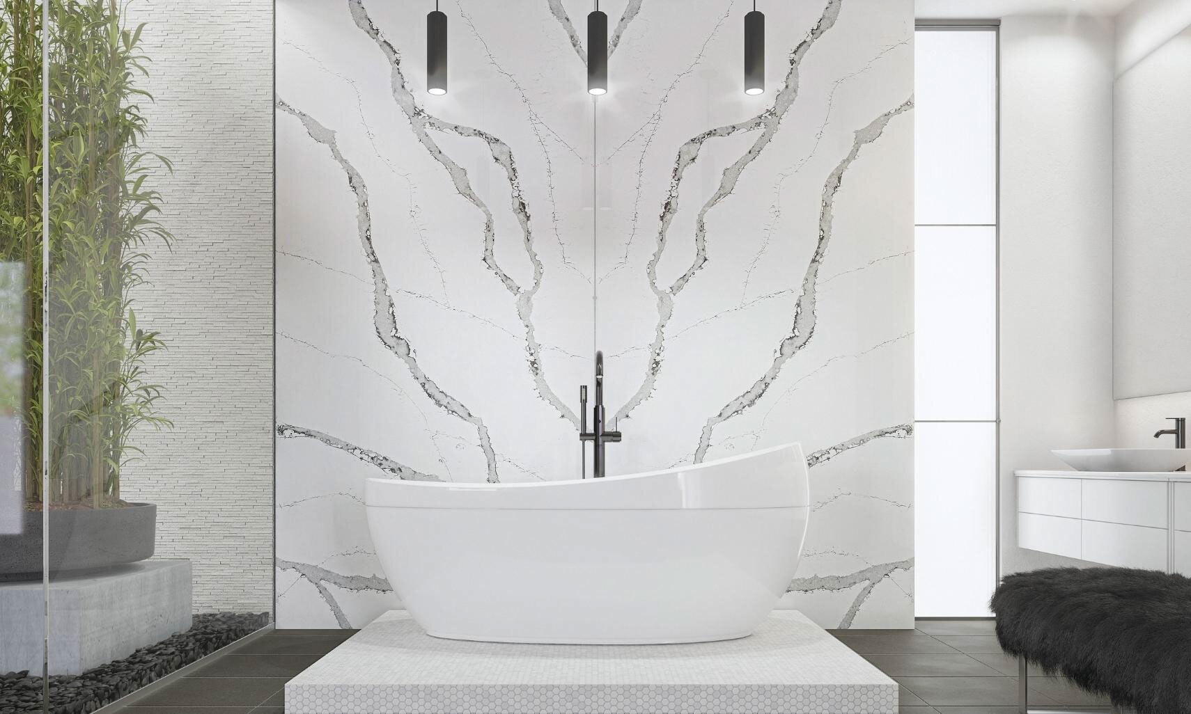 Modern bathroom décor with pendants over a soaker tub on a white pedestal, in front of white & gray book-matched quartz slab wall that looks like marble.