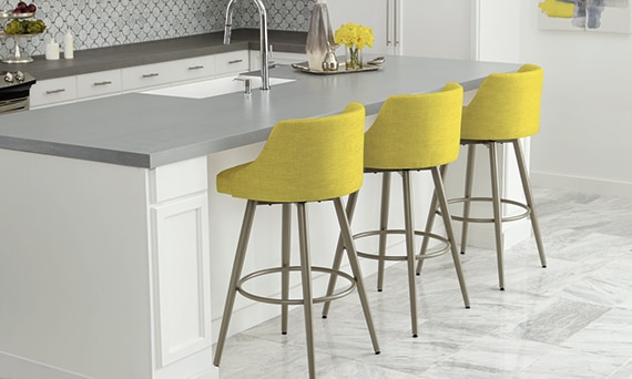 Kitchen island with sink and metallic look porcelain slab countertop, marble mosaic backsplash, and 12x24 marble floor tile.