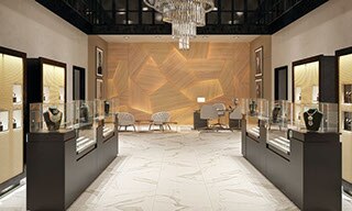 Fine jewelry store with off-white and gray large format floor tile, jewelry in glass cases, crystal and brass chandelier, and woodgrain wall with embedded lighting.