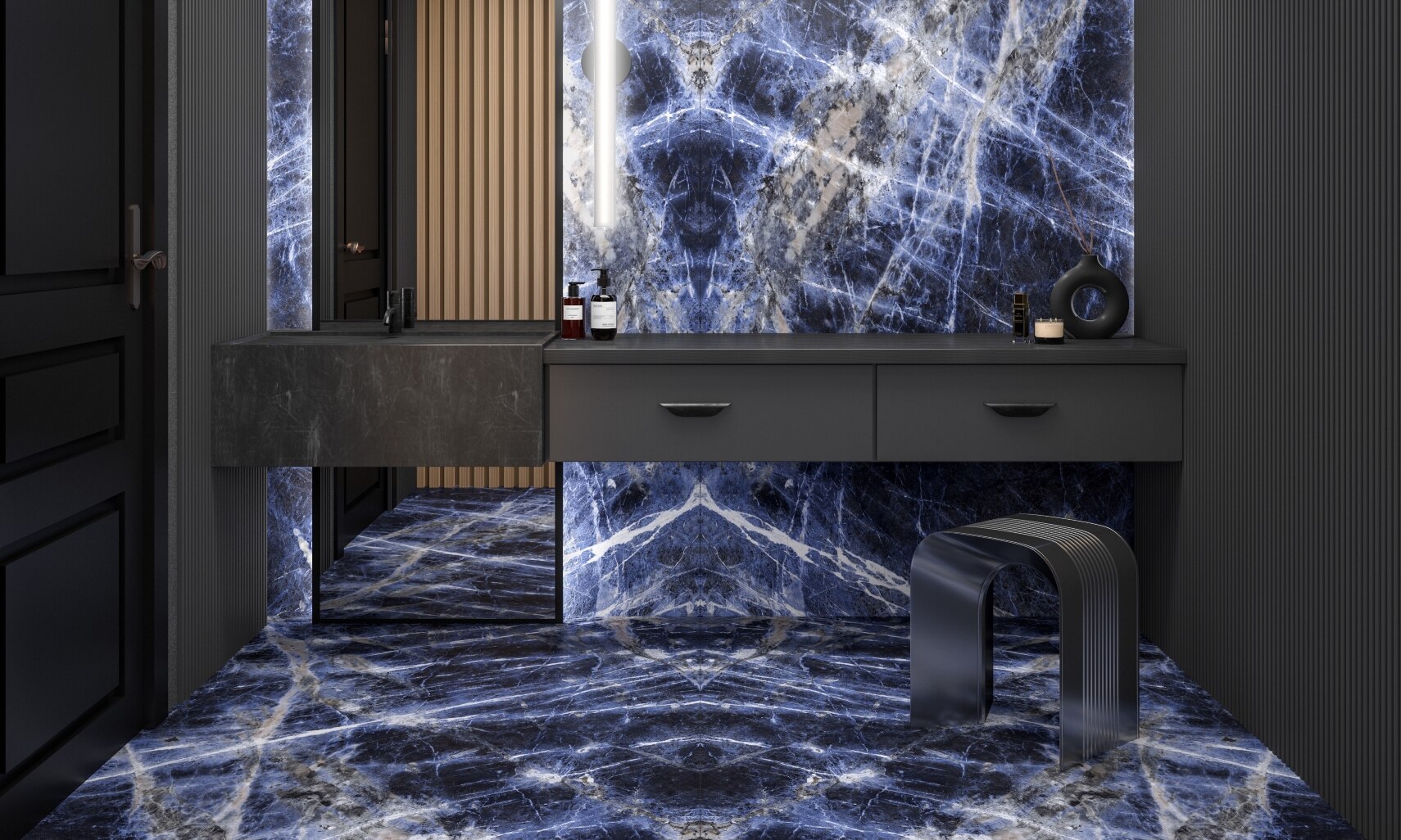 Bathroom featuring wall and flooring of large formal porcelain slab with dark blue and white veining that looks like marble, floor-to-ceiling mirror, and dark grey floating vanity.