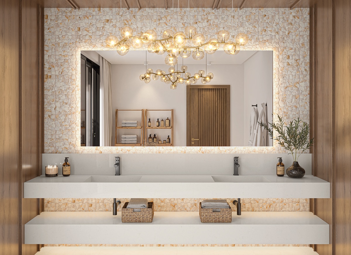 Bathroom vanity with hanging chandelier, mosaic on the back wall, wood walls, and a white marble slab countertop.