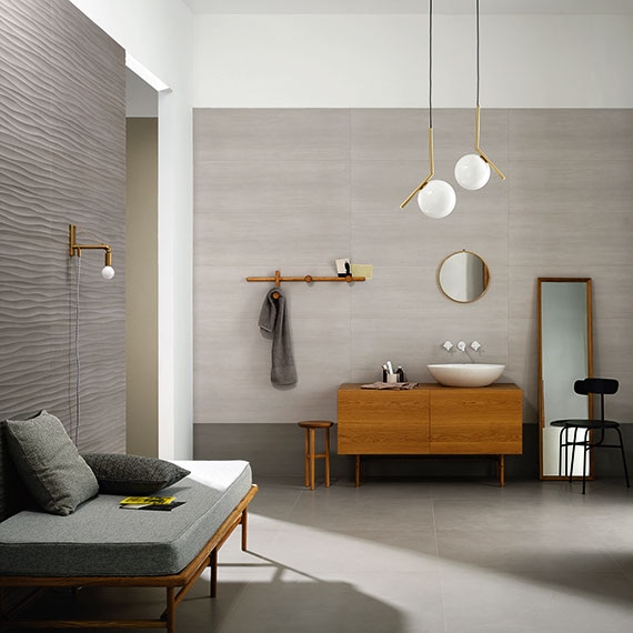 Modern minimalist bathroom with soaking tub and gray large format tile on the floors and walls