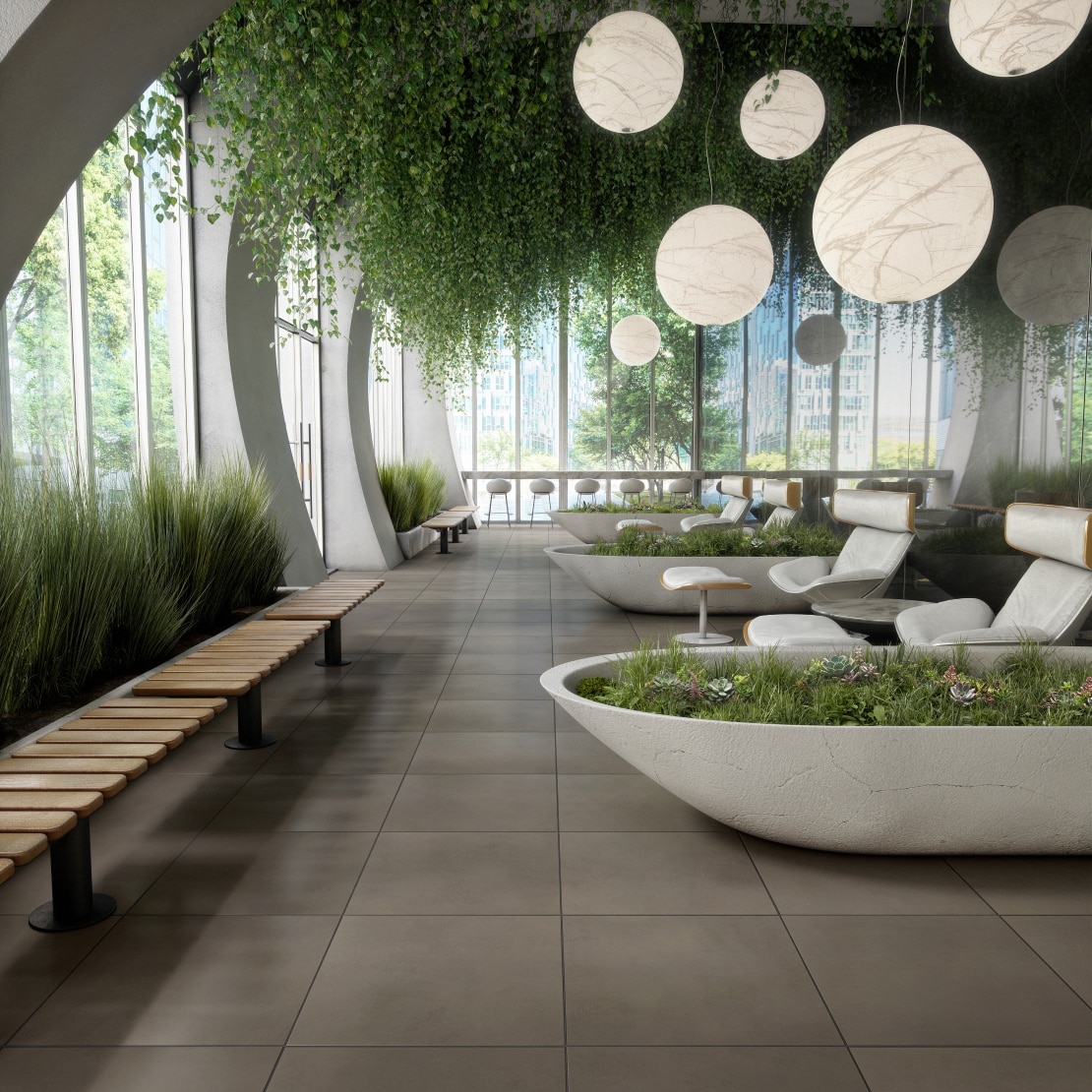 Garden room with plants on the ceiling, orb lights and concrete looking flooring.
