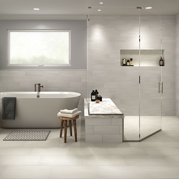 Contemporary gray and white bathroom with large soaking tub and walk in shower