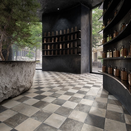 Hallway with checkered floor and tree.