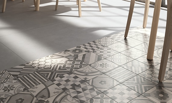 Bistro style restaurant with gray and white encaustic tile rug floor