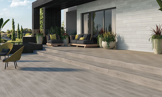 Outdoor patio with wood look tile on the floor and wall