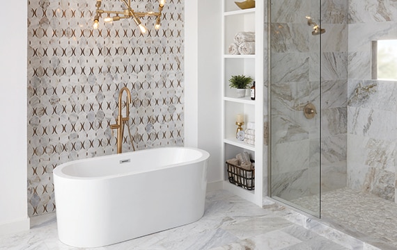 Large bathroom with white and tan marble on the walls and floor with a feature wall of marble mosaic